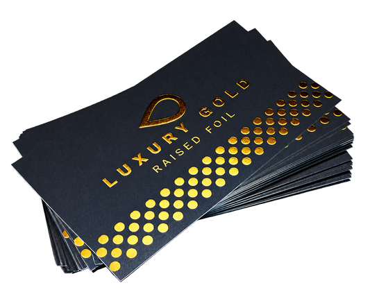 Dark business cards with raised metallic gold foil lettering and dots