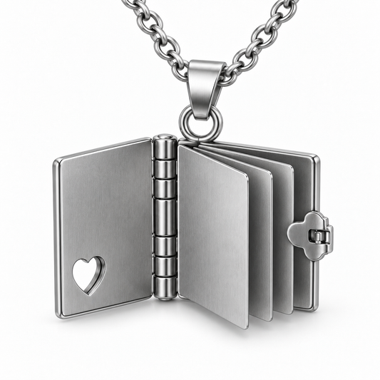 Close-up of open mini book pendant showing blank stainless steel pages